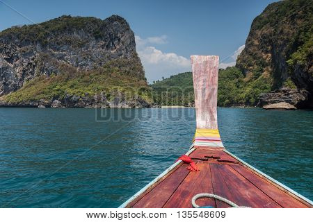 Thai Wooden Head Longtail Boat Heads Toward