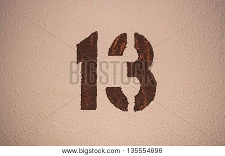 The number thirteen painted on the wall