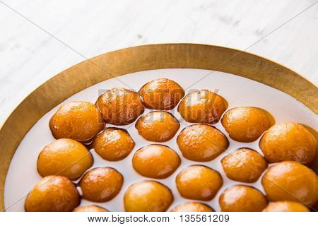 Gulab jamun, or gulaab jamun, is a milk-solids-based sweet mithai