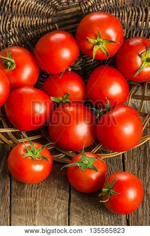 Ripe Tomatoes on wooden surface. Selective focus
