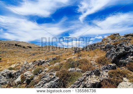 mountainous landscape of volcanic rocks on the background of clouds and sky