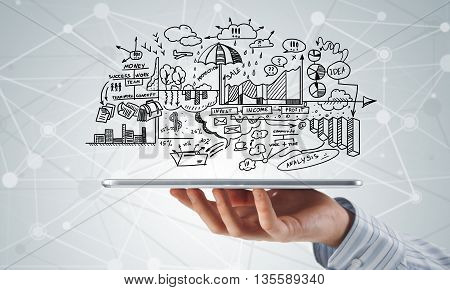 Businessman hand demostrating business strategy plan on tablet screen