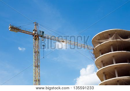 stopped construction of high-rise building. construction crane and unfinished high house