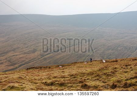 BRECON BEACONS, WALES, 27 FEB 2016.  Editorial Photograph of Lone Hiker on Slopes of Pen y Fan, Brecon Beacons National Park, South Wales