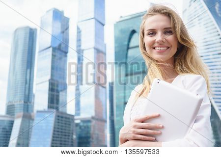 Young beautiful woman with tablet pc outdoor