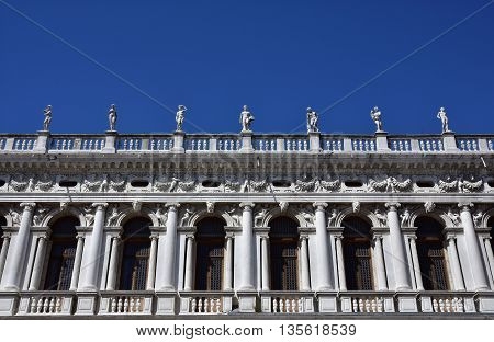 Beautiful monumental balustrade with statues designed by the famous renaissance architect Sansovino in the 16th century in Saint Mark Square