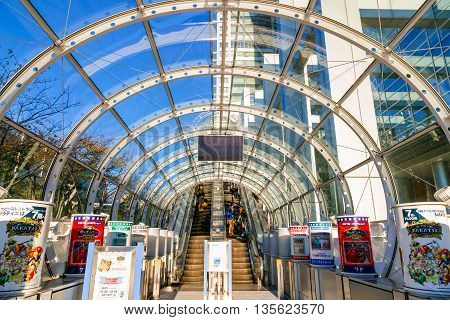 TOKYO JAPAN - NOVEMBER 27 2015: Fuji T.V. headquarters one of the most striking buildings in Japan. its' futuristic metallic clad building featuring a massive silver ball 32 metres in diameter