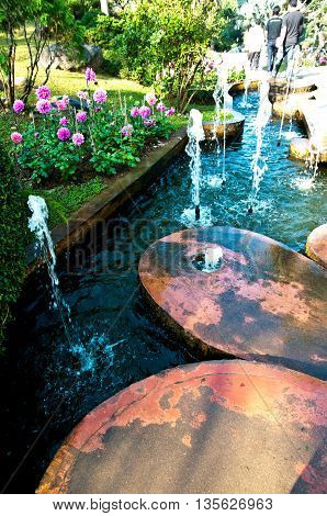 Beautiful garden place with gorgeous green pond and fountainDoi-Tung Chairai Thailand