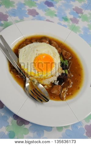 Fried rice with egg and pig on a plate