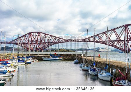 South Queenferry Scotland - July 29 2012: Lothian area the Forth Rail Bridge seen from harbor