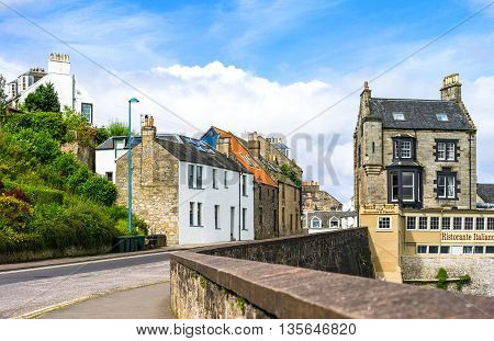 South Queenferry Scotland - July 29 2012: Lothian area traditional houses in High Street with an the Italian retaurant on the right