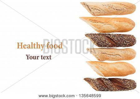 Cut baguette bread of different varieties on a white background. Rye wheat and whole grain bread. Isolated. Decorative frame of bread. Food background. Copy space.