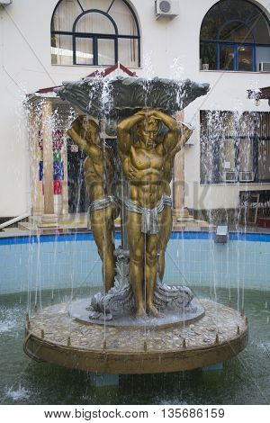 Lazarevskoye disrict, Sochi, Russia - September 05, 2013 - Fountain Golden men in Lazarevskoye town Sochi Russia