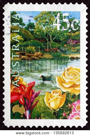 AUSTRALIA - CIRCA 2000: a stamp printed in the Australia shows Garden Pond Roses and Purple Swamphen circa 2000