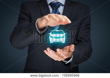 Car (automobile) insurance and collision damage waiver concepts. Businessman with protective gesture and icon of car.