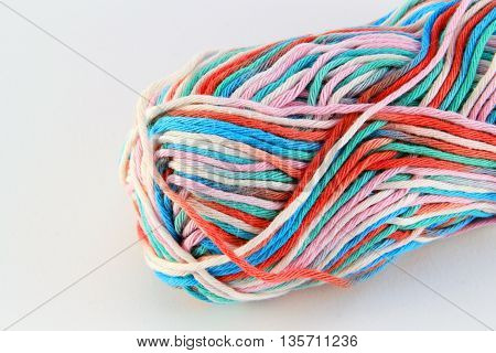 bale of wool of different colors with white background