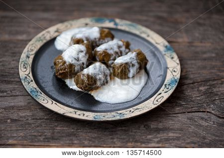 Romanian sarmale which are vine leaves stuffed with meat and rice