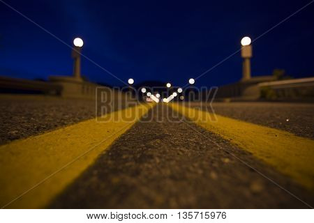 The double yellow lines leading over the bridge to Washington's Lake Chelan.