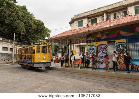 Rio de Janeiro, Brazil - June 18, 2016: New version of the classic yellow tram of Santa Teresa riding in the streets.