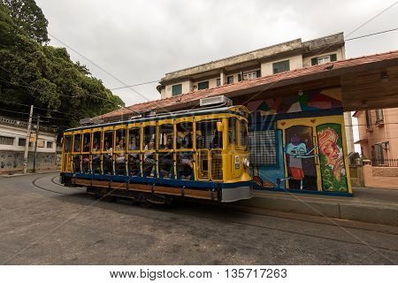 Rio de Janeiro, Brazil - June 18, 2016: New version of the classic yellow tram of Santa Teresa riding in the streets.