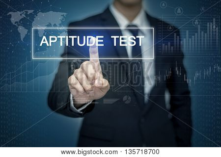 Businessman hand touching APTITUDE TEST button on virtual screen