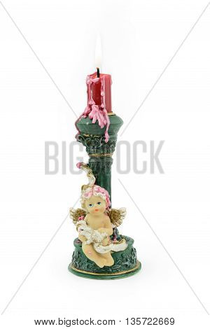 Bruning red aroma candle with wax on cupid holder isolated white background