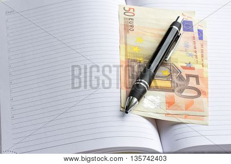 Money euro cash. money in an open notebook