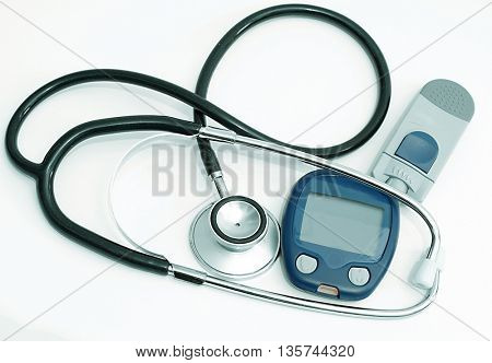 Stethoscope and device for measuring blood sugar level isolated on white background