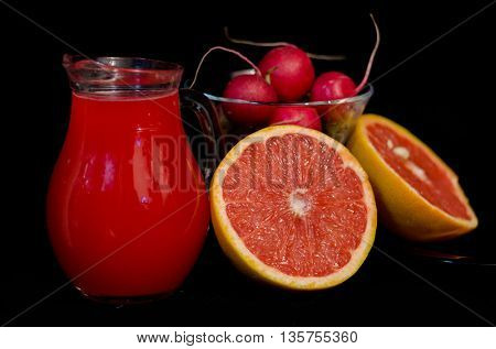 red juices in glasses and fruits and vegetbles
