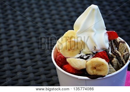 Frozen yogurt with fruit and chocolate wafers