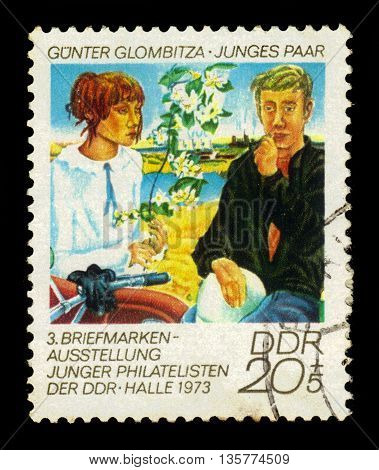 GERMANY - CIRCA 1973: a stamp printed in the Germany, Democratic Republic (DDR)  shows young couple, painting by Gunter Glombitza, circa 1973