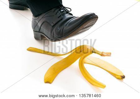 Walking Businessman Is Going To Slip On Banana Peel.