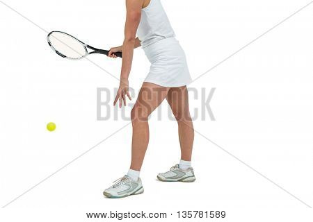 Athlete playing tennis with a racket on white background