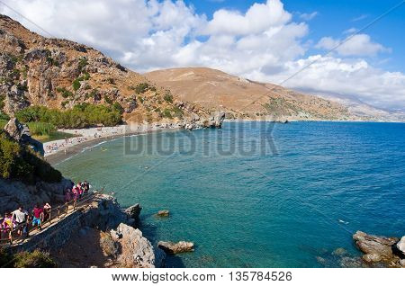 CRETEGREECE-JULY 23:Tourists go downstairs to the Preveli Beach on July 232014 on CreteGreece. The beach of Preveli is situated 40 km south of the main town and is the most idyllic beach in Crete.