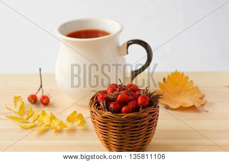 rose hip tea on a wooden background