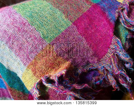 Colorful ethnic hand woven fabric material cloth on display in a market