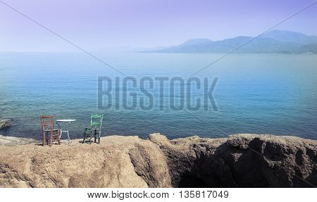 Wooden vintage table set with blue sky and sea background