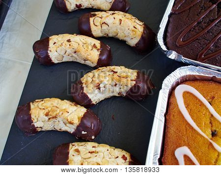Selection of famous traditional European marzipan pastry cookies on display at the bakery