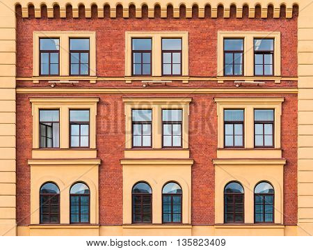 Several windows in a row on facade of urban office building front view St. Petersburg Russia