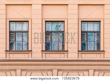 Several windows in a row on facade of urban office building front view St. Petersburg Russia