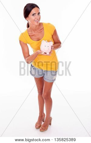 Smiling Young Brunette With Piggy Bank