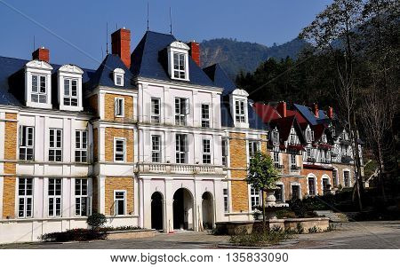 Bai Lu China - November 17 2013: Normandie style faux chateau and adjoining half-timbered manor houses in the charming Sino-French village