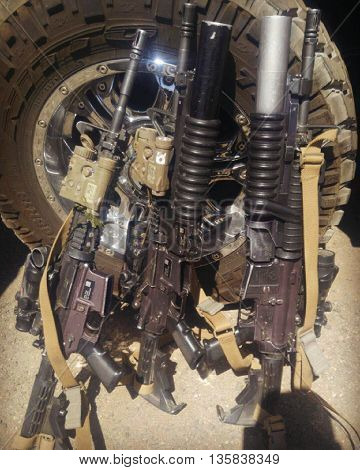 Three military grade M4s with multiple attachments