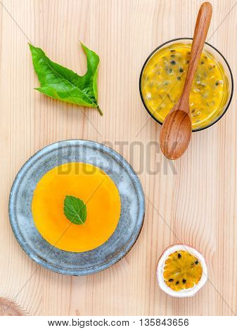 Passion Fruit Cheesecake With Fresh Mint Leaves On Wooden Background. Passion Fruit Cheesecake Setup