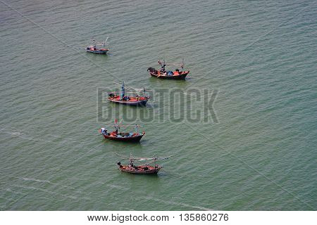 Five Fishing Boats Lying On The Sea