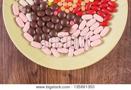 Colorful Medical Pills, Tablets And Capsules On Plate, Health Care Concept