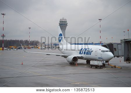 SAINT PETERSBURG, RUSSIA - DECEMBER 12, 2015: A Boeing 737-500 (VQ-BJQ) airlines UTair stands at the gangway of the airport Pulkovo