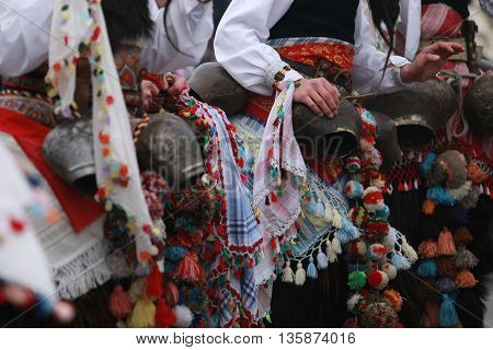 Pernik, Bulgaria - January30, 2010: Unidentified man in traditional Kukeri costume are seen at the Festival of the Masquerade Games Surva in Pernik, Bulgaria.