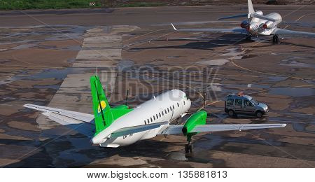 Kiev Ukraine - May 17 2012: South Airlines Saab 340B parked on the apron of the airport with another plane and a 
