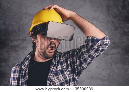 Construction engineer with VR goggles managing building project futuristic 3d cyberspace technology in architecture and construction industry